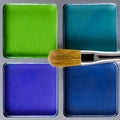 Palette of blue and green eye shadow and makeup brush, top view Royalty Free Stock Photo