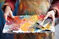 palette and brushes in artists hand Royalty Free Stock Photo