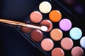 Palette concealer and correctors. Make-up base on black background Royalty Free Stock Photo