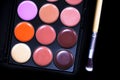 Palette concealer and correctors. Make-up base on black background Royalty Free Stock Photo