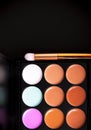 Palette concealer and correctors. Make-up base on black background Royalty Free Stock Photo