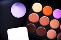 Palette concealer and correctors with sponge make up . Make-up base on black background Royalty Free Stock Photo