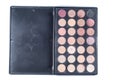 Palette with different shades of face shadows and brush applicator for application. Set for makeup on a white background, isolate Royalty Free Stock Photo