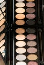 Palette of eye shadow close-up reflected in mirror. Royalty Free Stock Photo