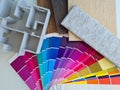 Palette of house plan color swatches on office desk