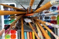 Palette knives with paint brushes in holder, closeup