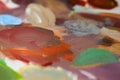 A palette with mixed multi-colored oil paints, an image with a bokeh effect Royalty Free Stock Photo