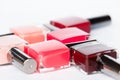 A palette of nail polish bottles on a white background