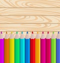 Palette Pencils on Wooden Background