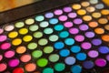 Palette professional colorful eye shadows. Makeup set background.