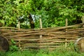 Palisade garden wooden fence landscaping object with vivid green foliage nature background scenic