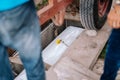 Pallbearers carefully oversee the process of lowering the casket to the ground for the deceased to its final place of rest Royalty Free Stock Photo