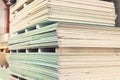 Pallet with Drywall sheets plasterboard in the building warehouse store. Stacking of white gypsum panels, drywall or plasterboard Royalty Free Stock Photo