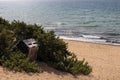 Pallet house on the beach, homelessness or loneliness. Problem