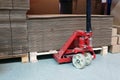 Pallet jack and empty cardboard boxex Royalty Free Stock Photo