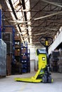 Pallet jack in the industrial hall Royalty Free Stock Photo