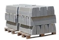 The pallet with a stack of concrete curbstone on white Royalty Free Stock Photo