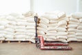 Pallet trask in stock with bags of flour in storage Royalty Free Stock Photo