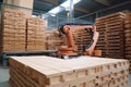 palletizing robot, handling and stacking wooden pallets in warehouse