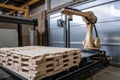 palletizing robot loading heavy objects onto pallets with motorized gripper