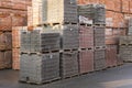 Pallets with bricks in the building store. Racks with brick. Masonry, stonework. Several pallets with concrete brick stacked on