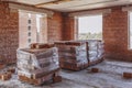 Pallets with bricks inside a multi-storey building