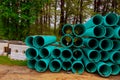 Pallets of green sewer pipes at construction for drainage system Royalty Free Stock Photo