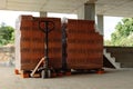 Pallets with red bricks at the stage of construction in a new building Royalty Free Stock Photo