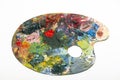Pallette with brushes on a white background Royalty Free Stock Photo