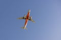 Palm Beach QLD Australia - 19 June 2023: Jetstar passenger plane flying overhead in beautiful blue sky