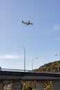 Palm Beach QLD Australia - 19 June 2023: Jetstar plane flying over the Currumbin Creek Estuary Bridge