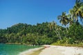 Palm Beach In Tropical Idyllic Paradise in Koh Kood island, Thailand. Beautiful tropical beach blue sky and coconut palm trees. Royalty Free Stock Photo