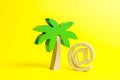 Palm figurine and symbol of internet or email. Remote work, part-time job. Outsourcing services. Work during vacation or travel