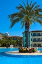 The palm and flower bed near the blue pool, Gypsophilia hotel, Alania, Turkey