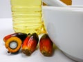 Palm fruits and palm oil, one fruit is cut to show its kernel Royalty Free Stock Photo