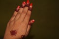 The palm of a girl with Mehandi design and nail poilish Royalty Free Stock Photo