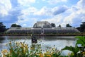 The Palm House in Kew Gardens with lakeside view Royalty Free Stock Photo