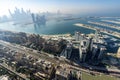 The Palm island panorama with Dubai marina rising in the background aerial view Royalty Free Stock Photo