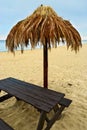 Palm leaf beach umbrella on Baltic beach.