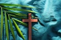 Palm leaves with wooden crucifix cross flat lay composition. Palm sunday background. Royalty Free Stock Photo