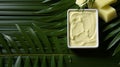 Palm oil buttercream and yeast decorated with palm leaves monochromatic background.