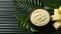 Palm oil buttercream and yeast decorated with palm leaves monochromatic background.
