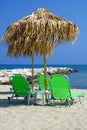 Palm parasol at summer beach Royalty Free Stock Photo