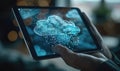 A palm resting on a transparent tablet showing cloud-based software applications