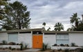 Palm Springs House with Slanted Roof and Orange Front Doors