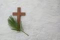 Palm sunday background. Cross and palm on grey background. Royalty Free Stock Photo