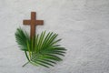 Palm sunday background. Cross and palm on grey background. Royalty Free Stock Photo