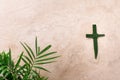Palm Sunday concept. Cross made of palm and tropical leaves. Christian moveable feast to celebrate Jesus' triumphal Royalty Free Stock Photo