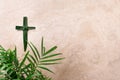 Palm Sunday concept. Cross made of palm and tropical leaves. Christian moveable feast to celebrate Jesus' triumphal