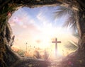 Cross and empty tombstone with palm leaves Royalty Free Stock Photo